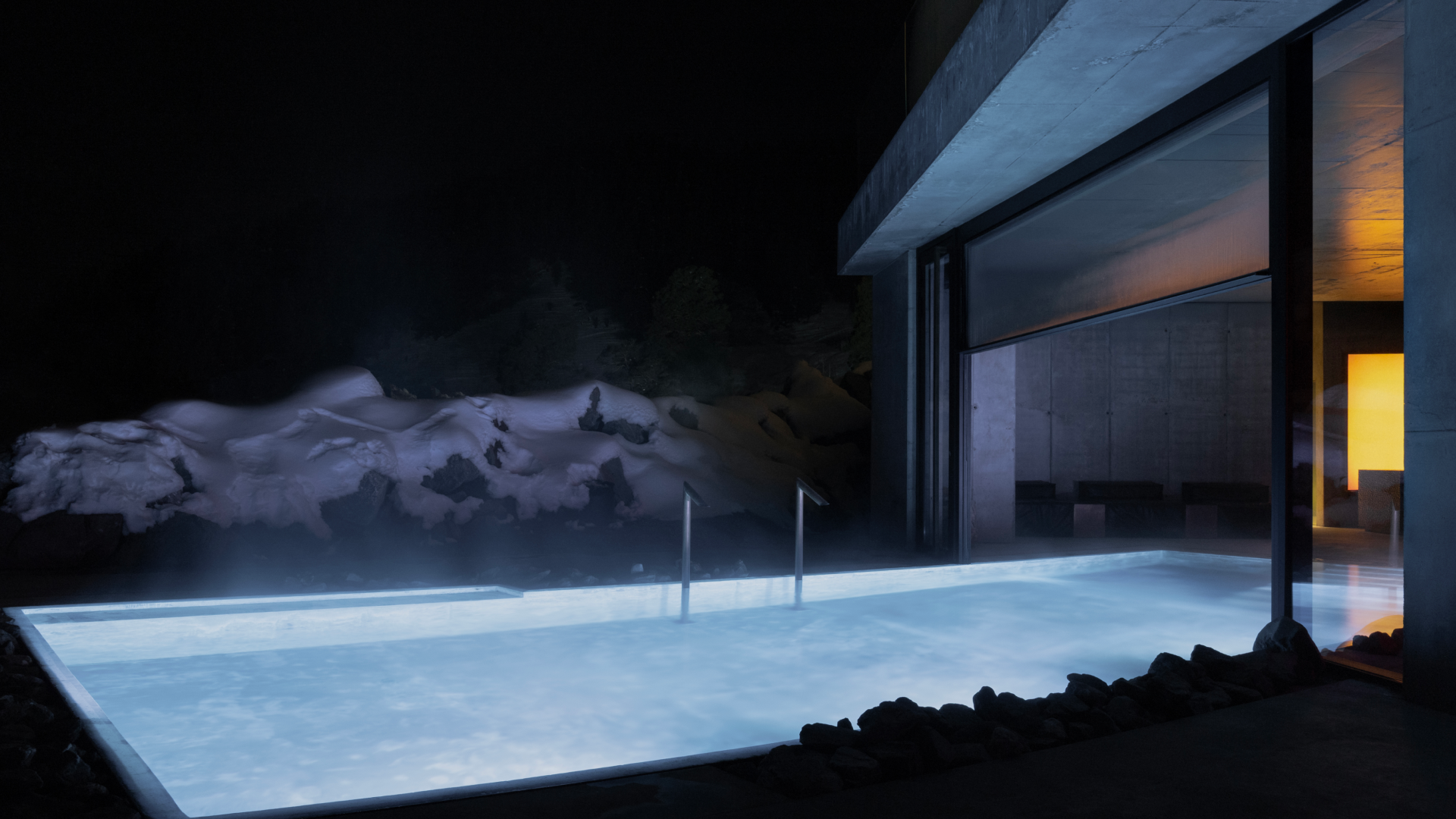 A hotel in the mountains with a heated swimming pool